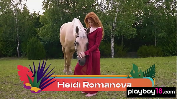 Redhead Latvian diva Heidi Romanova reveals her big natural boobs outdoor